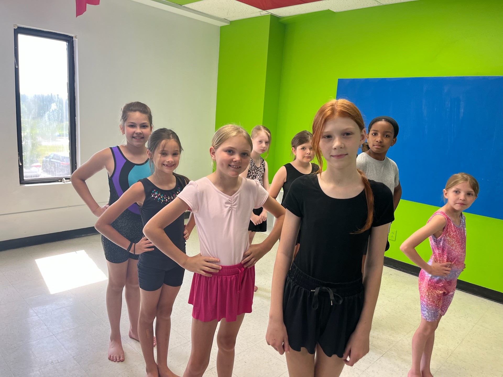 Dance class group posing together